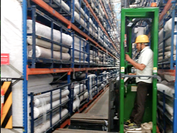 roll handling equipment for garment industry